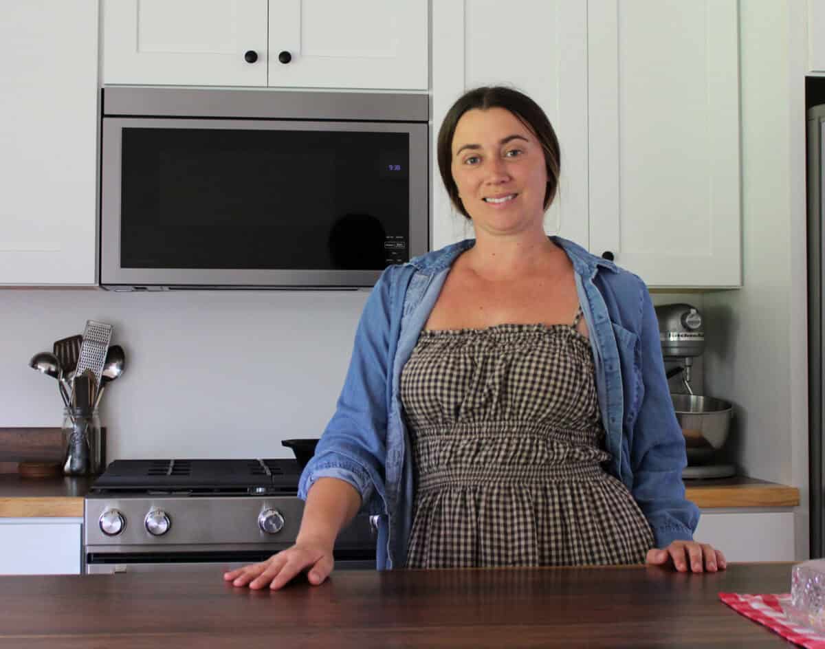 Alexis smiling in her kitchen