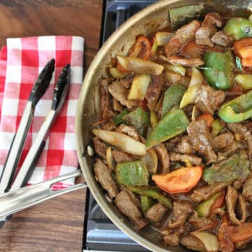 beef tomato stir fry in a large pan