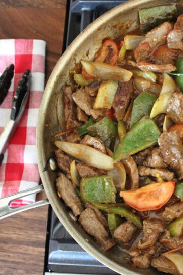 beef tomato stir fry in a large pan