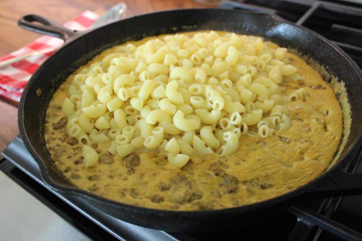 cooked macaroni on top of creamy beef 
