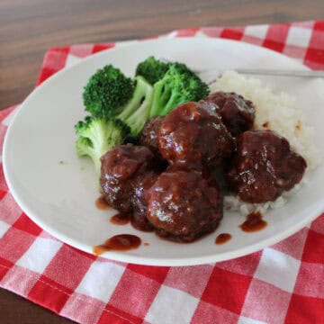 saucy meatballs served with white rice and broccoli