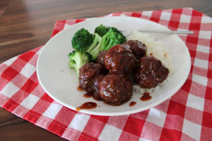 sweet and sour meatballs served with broccoli and white rice
