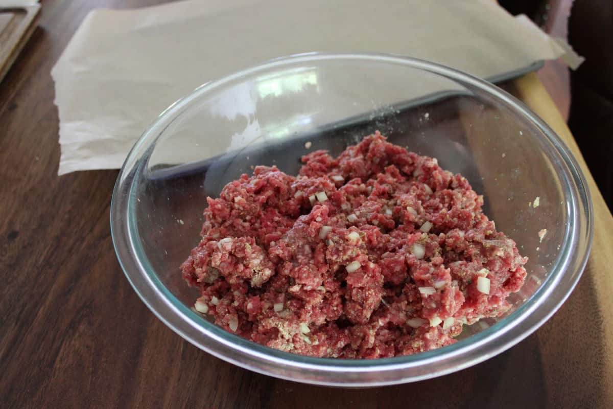meatball mixture in glass bowl ready to be scooped