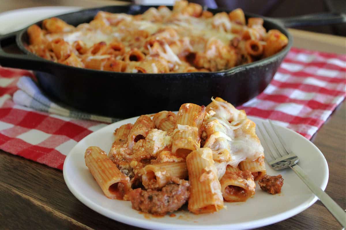 baked rigatoni with beef in a cast iron skillet