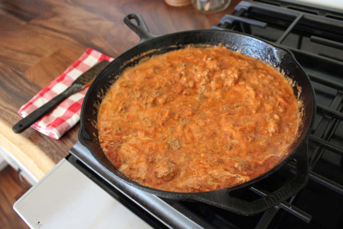 creamy meat marinara sauce in a cast iron skillet