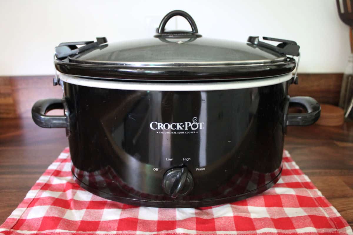 black crock pot on a wood counter top