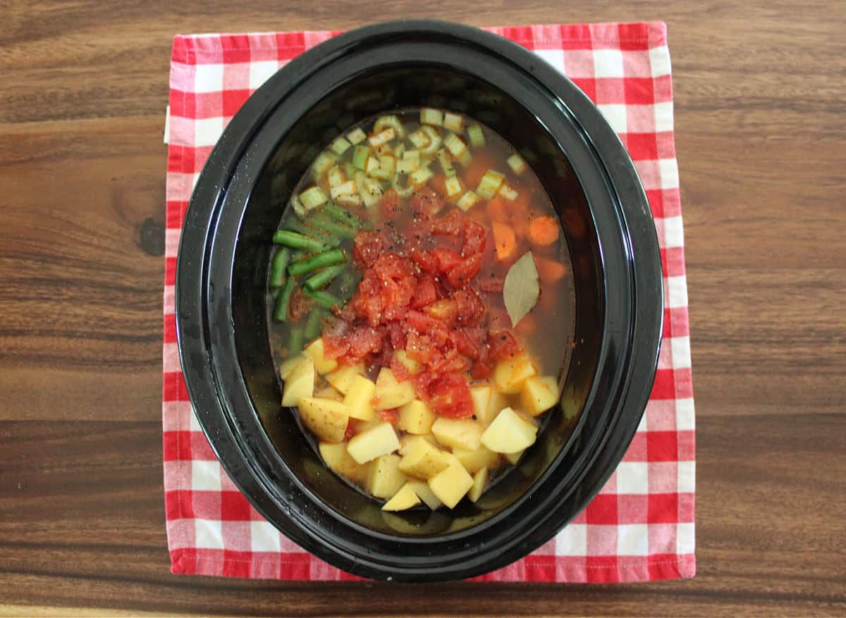 Uncooked poor man’s stew in a slow cooker.