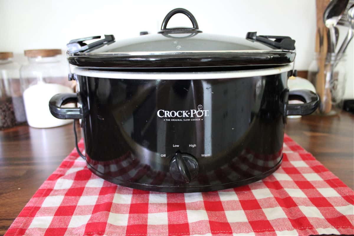 black crock pot on a wood counter top