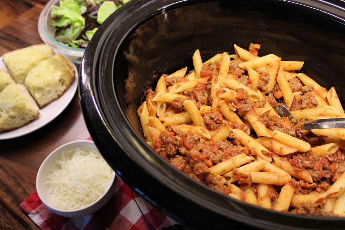 slow cooker with penne and venison bolognese