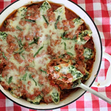 Large white dish with stuffed pasta shells.