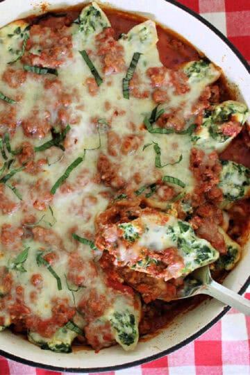 Large white dish with stuffed pasta shells.