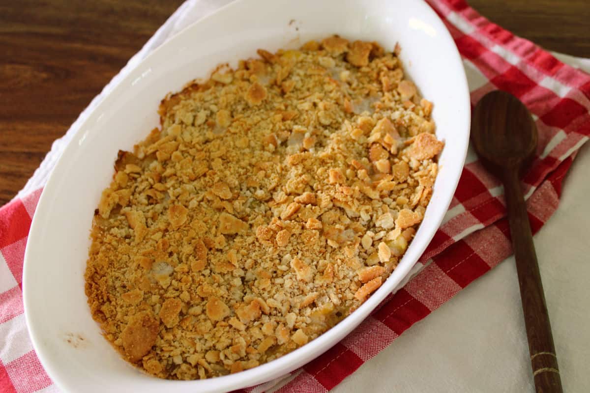 yellow squash casserole with golden brown topping of ritz crackers.